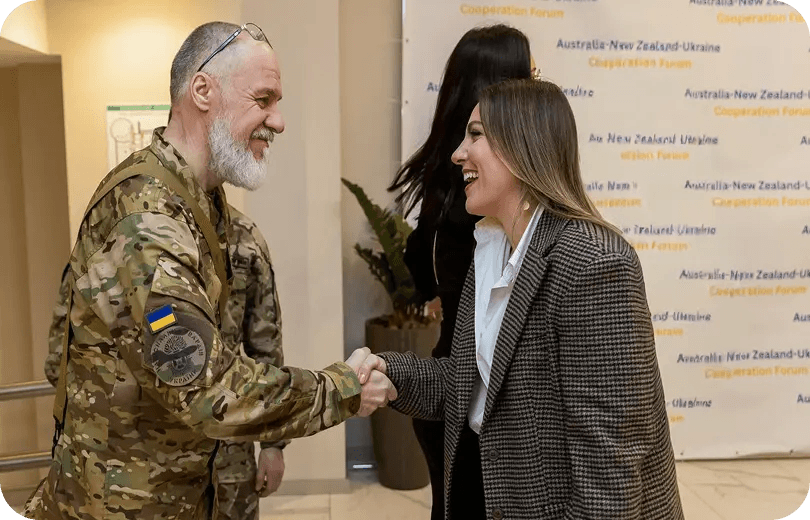 Foundation representative greeting a Ukrainian military officer